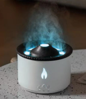 Air Humidifier emitting cool blue LED mist from compact white cylinder to freshen room air.