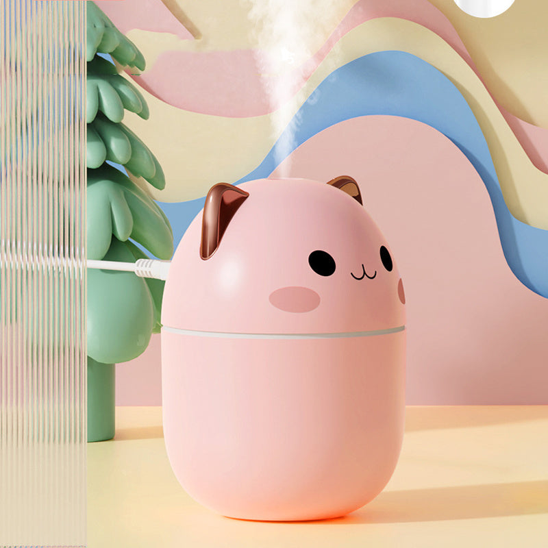 Cute multi-color LED cat Air Humidifier on nightstand, releasing cool mist—quiet USB-powered diffuser