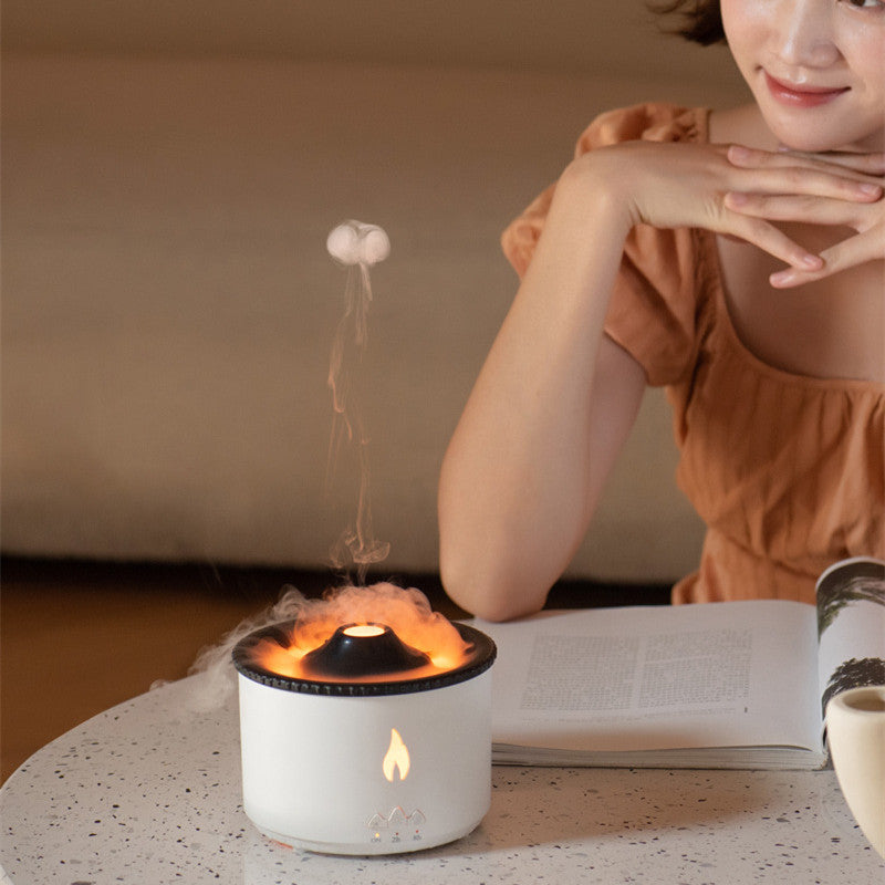 Air Humidifier beside woman reading, creating calming flame-like mist for a relaxing ambiance.